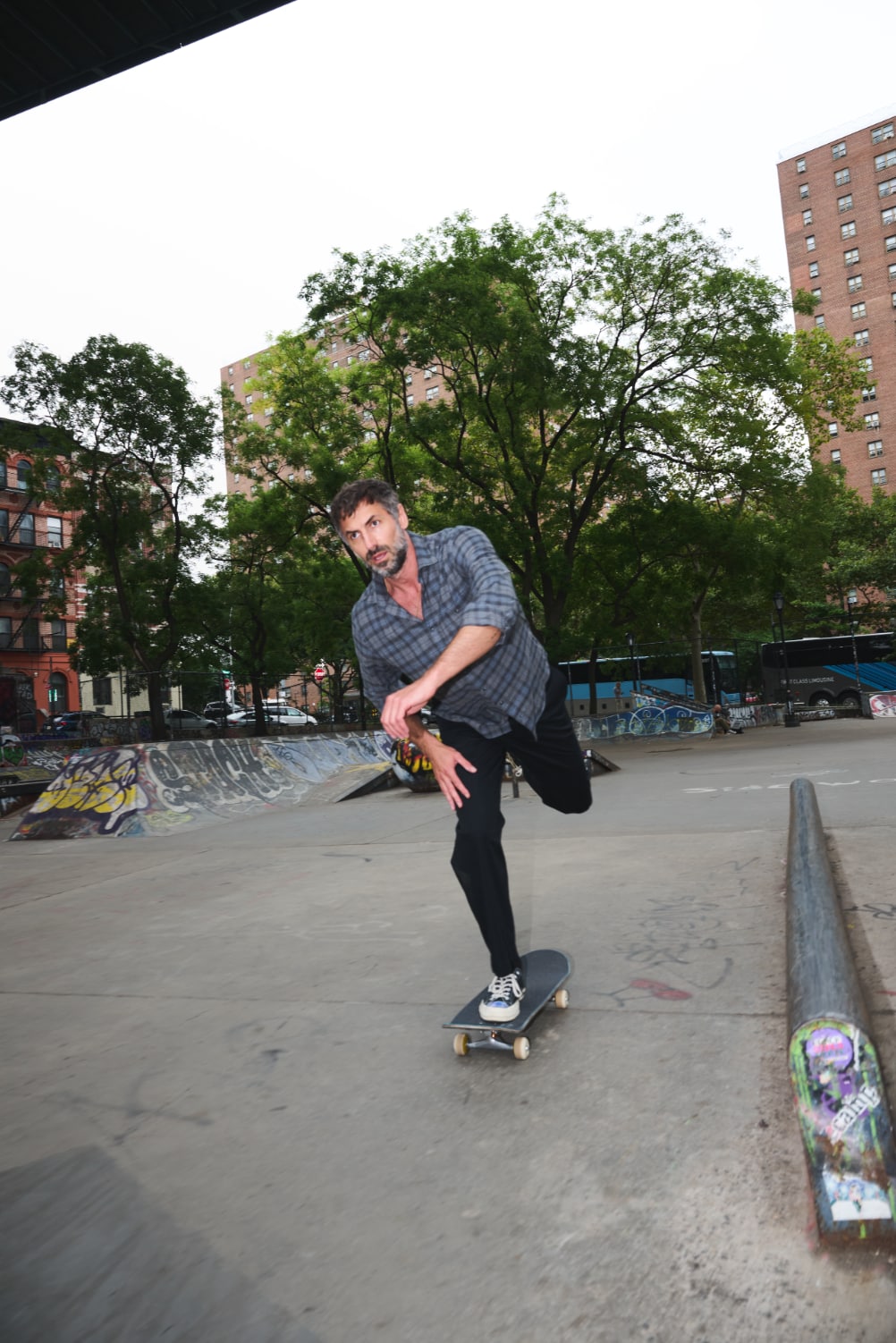 Man skating wearing a Satoyama casual shirt