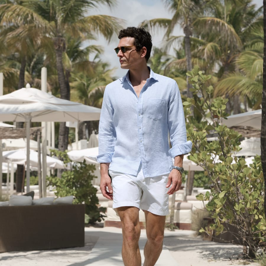 Man wearing a lightweight shirt on beach in Miami