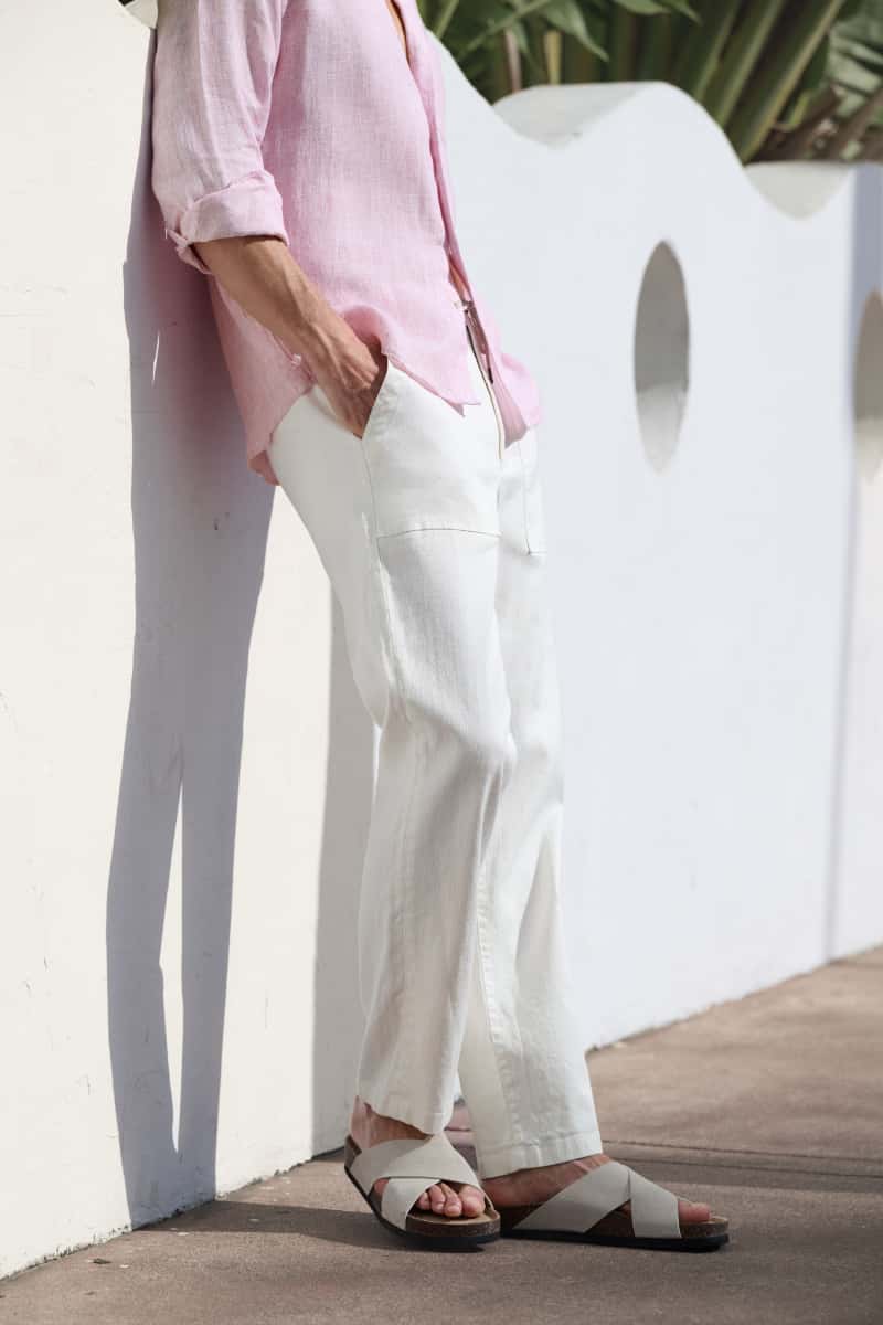 Man wearing lightweight white trousers