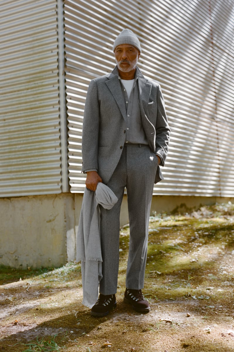 Man wearing light grey flannel downing suit.