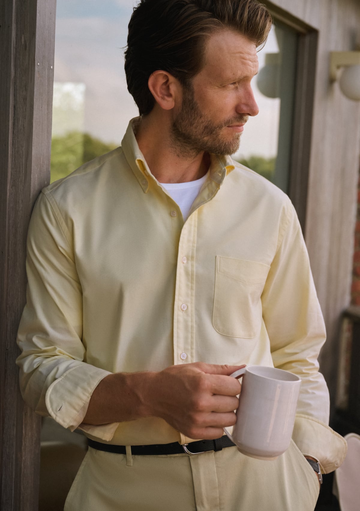 Man wearing yellow oxford shirt