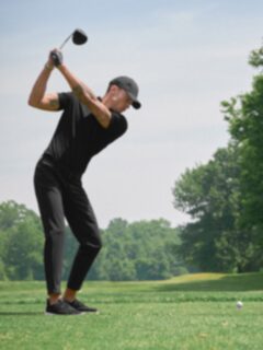 The Goldfinch Pique Golf Polo in Black