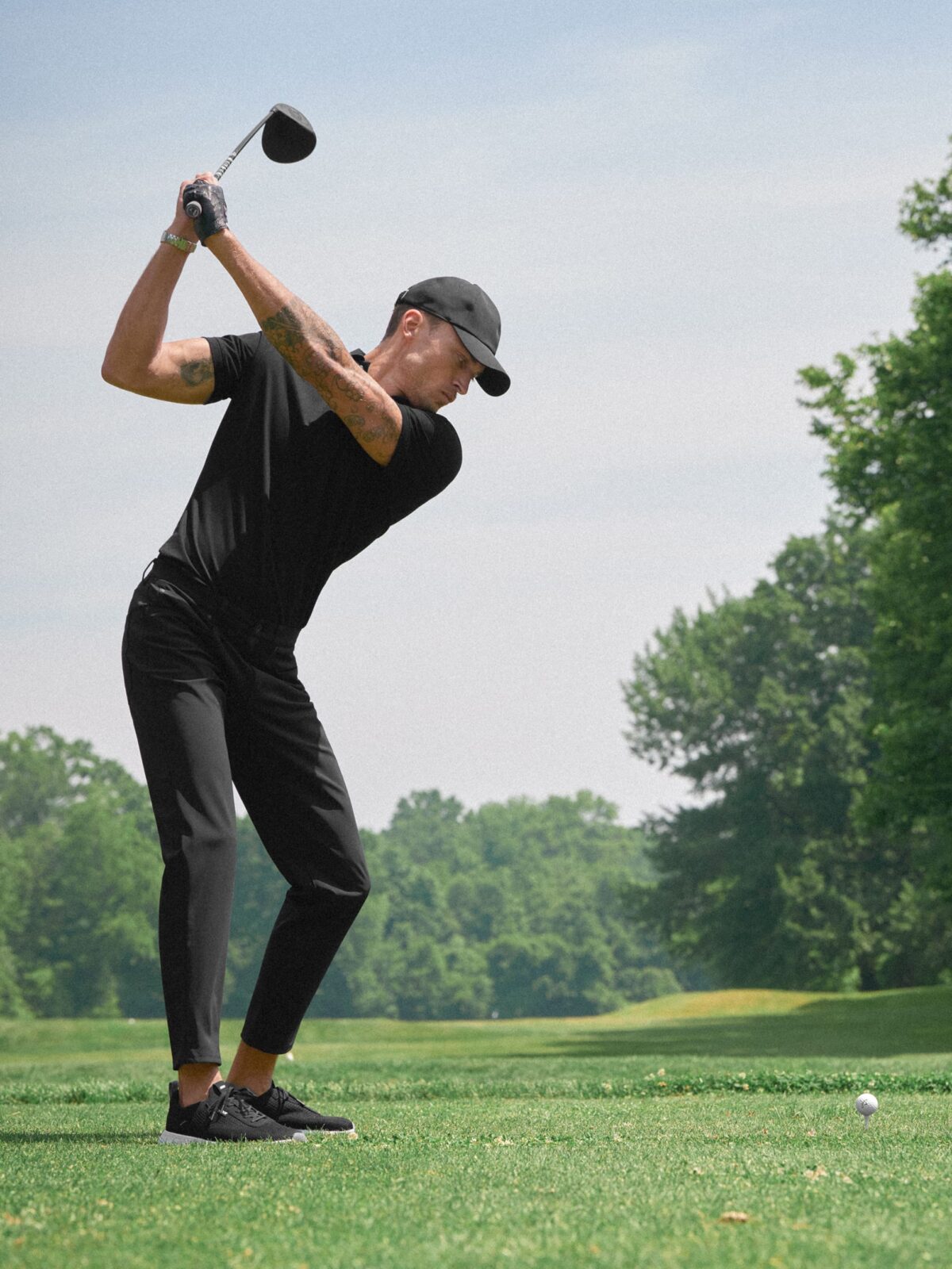 The Goldfinch Pique Golf Polo in Black