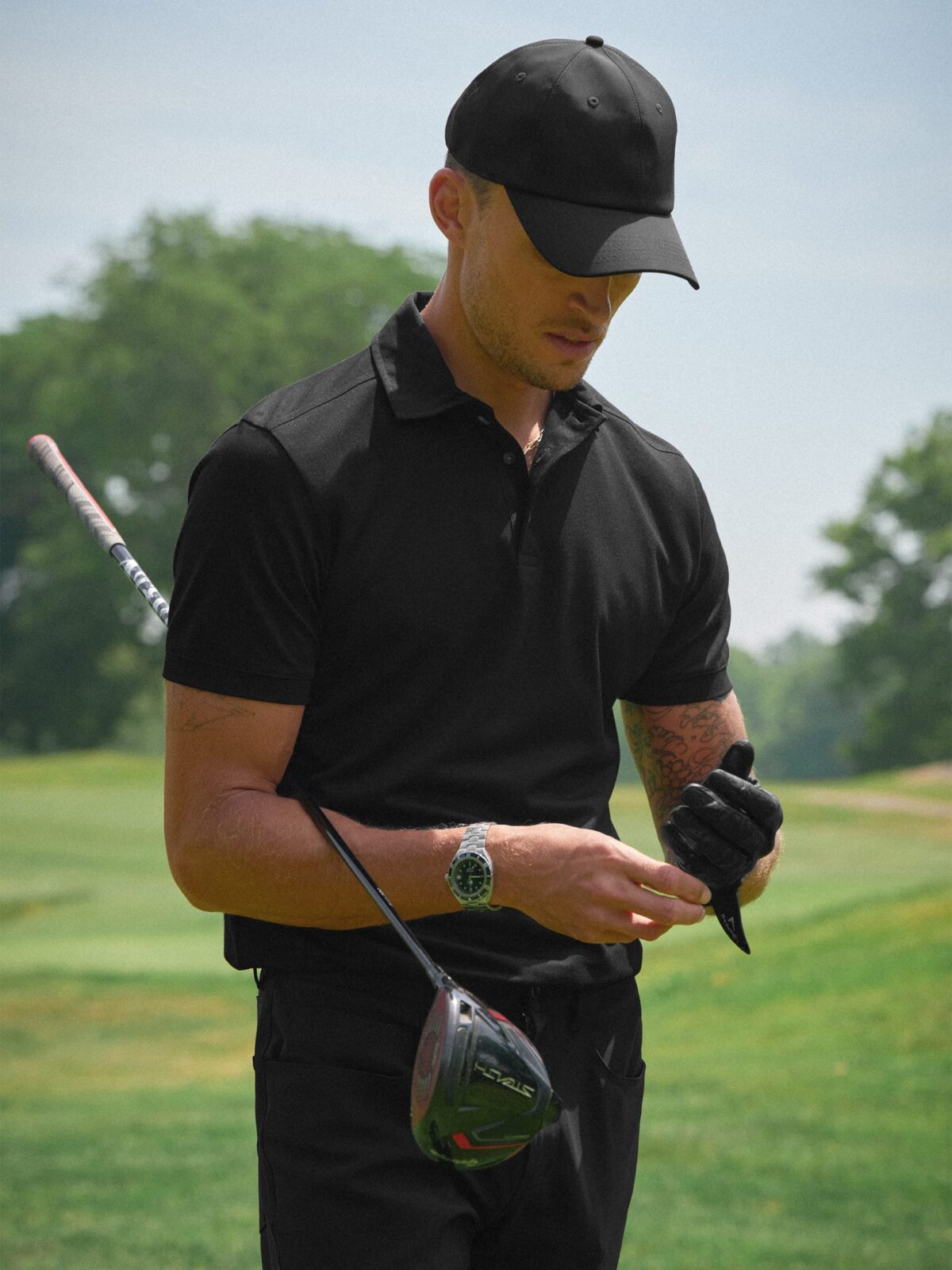 The Goldfinch Pique Golf Polo in Black