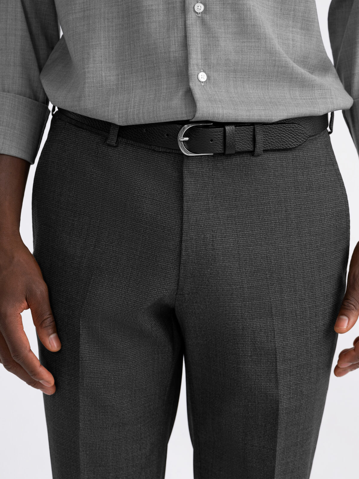 Light gray dress pants hand tailored in a fitted straight cut